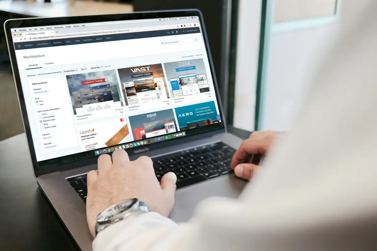 HAULS Journal photo of a person typing on a laptop with a web browser open