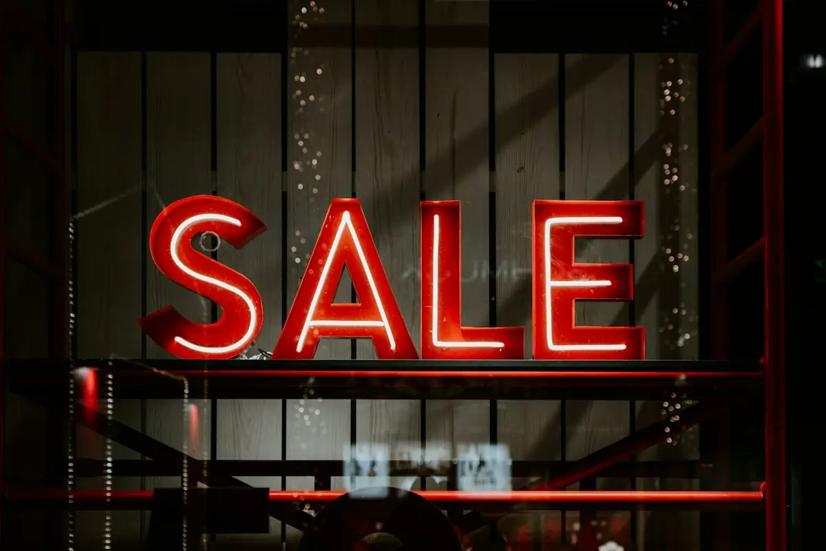 HAULS Journal photo of a red neon SALE sign in a shop window