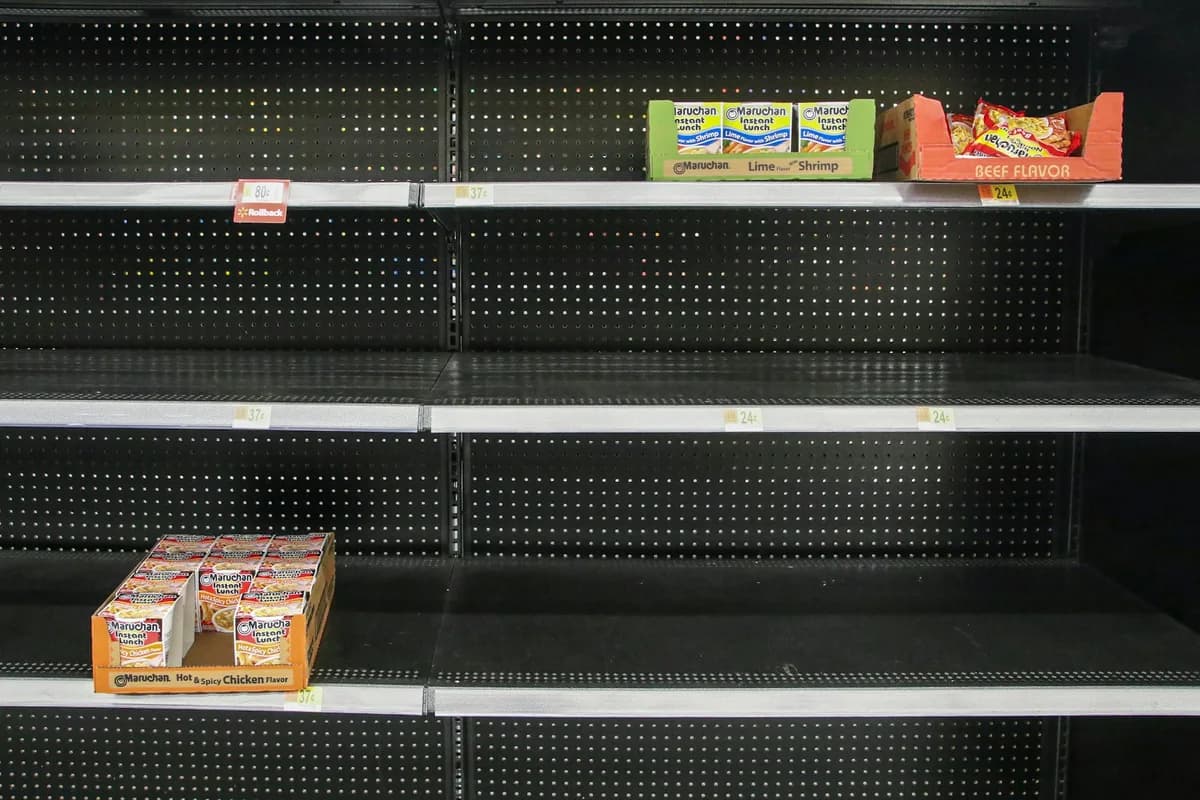 HAULS Journal photo of nearly empty black store shelves with just two small boxes of snacks left in place